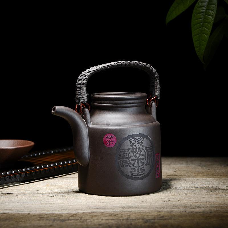 Théière artisanale en argile violette – 720 ml, anse en rotin ou cuivre